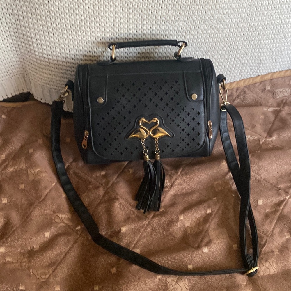 Cute shoulder bag two zippers clean no rips tears two hanging tassels